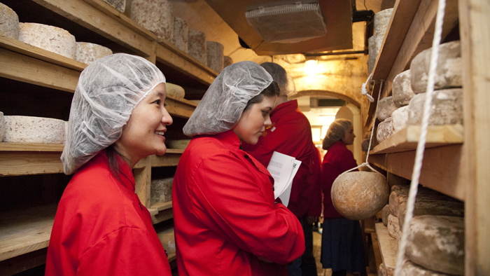 NSPE Food Studies students get up close and personal with the stash in the underground cheese cave on a field trip to Murray's Cheese. Photo by Jessica Miller, 2012.