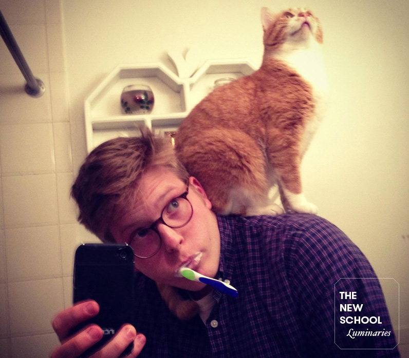 Eugene Lang College alumnus Miles Kohrman practices his cat-juggling skills while multitasking. Photo courtesy of Miles Kohrman.