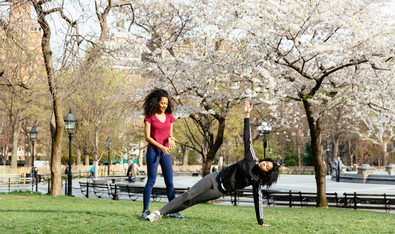 Students practice yoga in Washington Square Park in Greenwich Village.