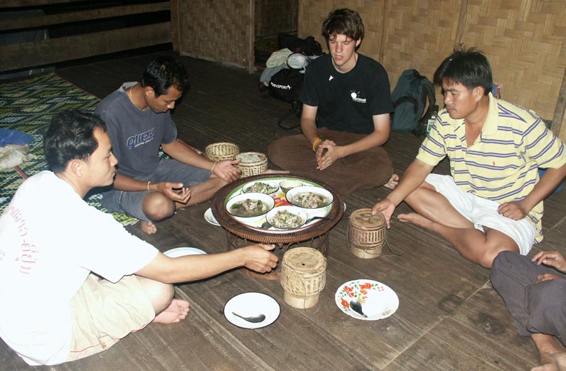 Simon Henschel (Environmental Policy And Sustainability Management ’16) meets with residents of Nam Kha, Laos, prior to installation of its off-grid power system.