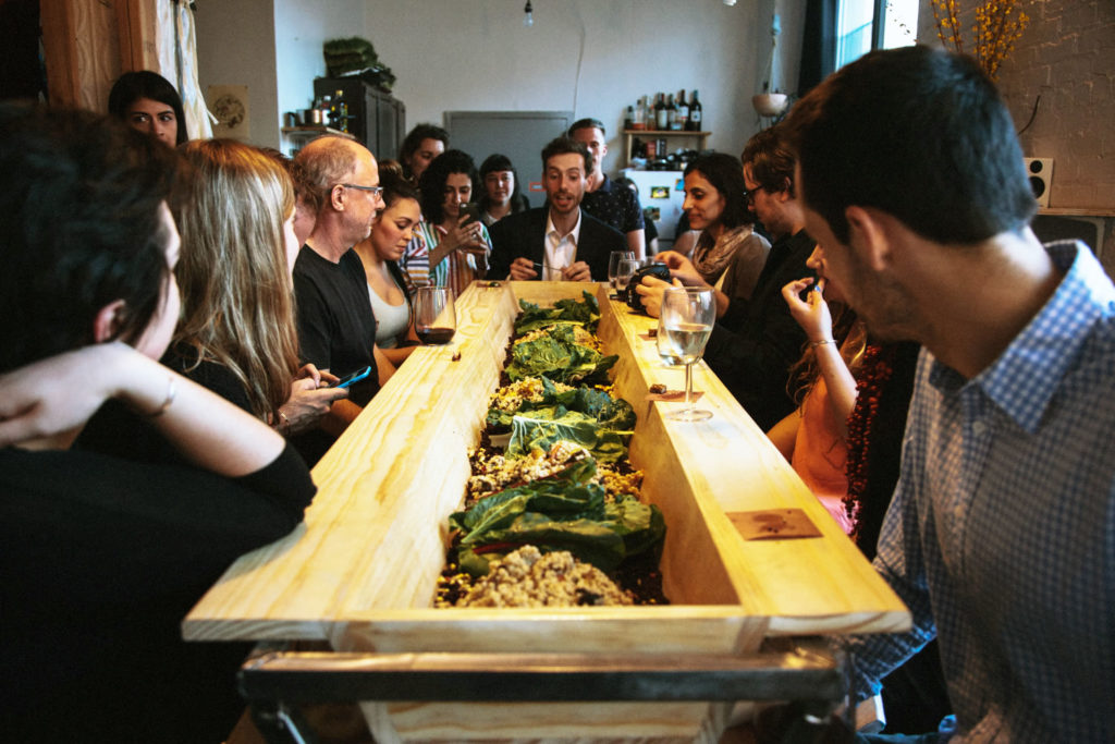 Misha Volf,  Design Studies ’16, describes the menu at the inaugural edition of Fodder. (Photo/Liam Quigley)