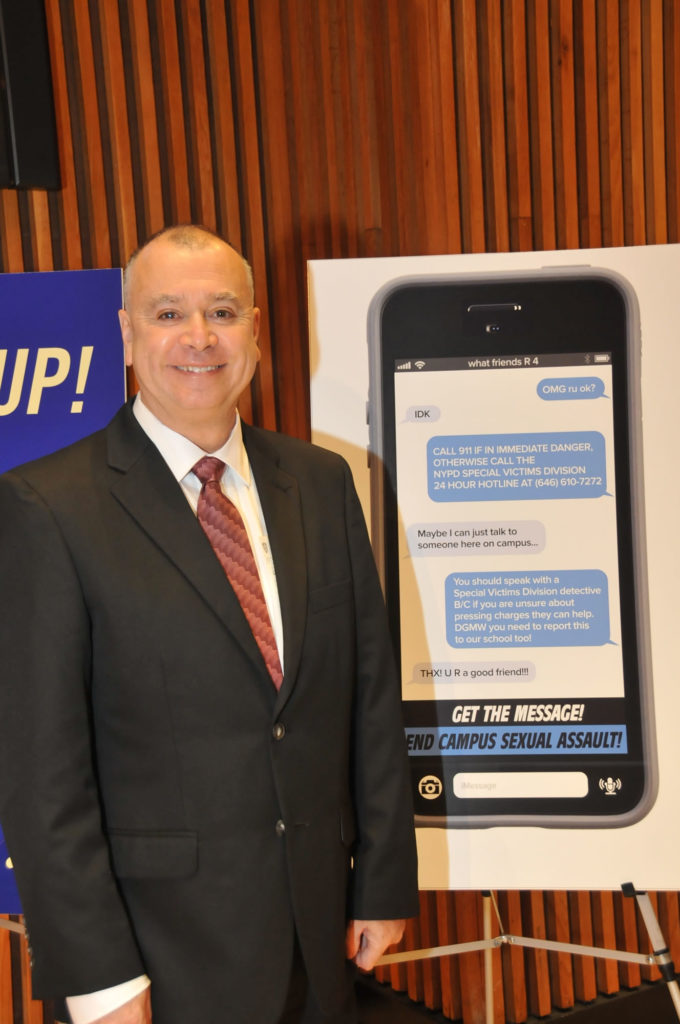 Freddie Dessau with his poster design, which took 2nd place in the NYPD poster contest to encourage victims of sexual assault to report the crimes.