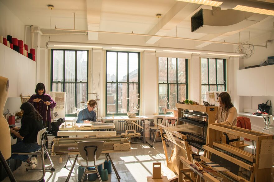 Students from the new MFA Textiles program working in a studio