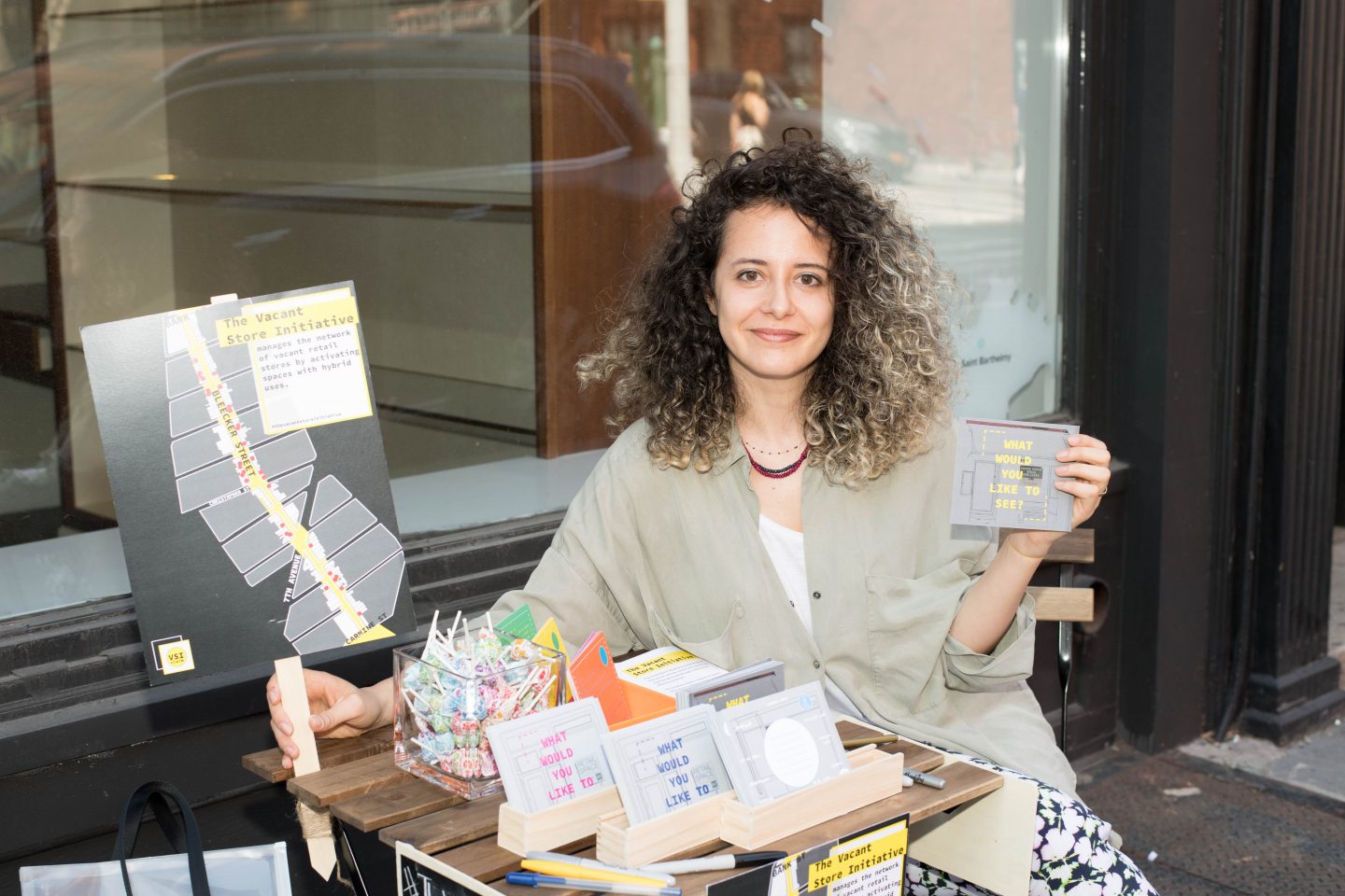 Irem Yildiz on Bleecker Street as part of her Vacant Store Initiative. 
Photograph by Erica Freudenstein Photography. 