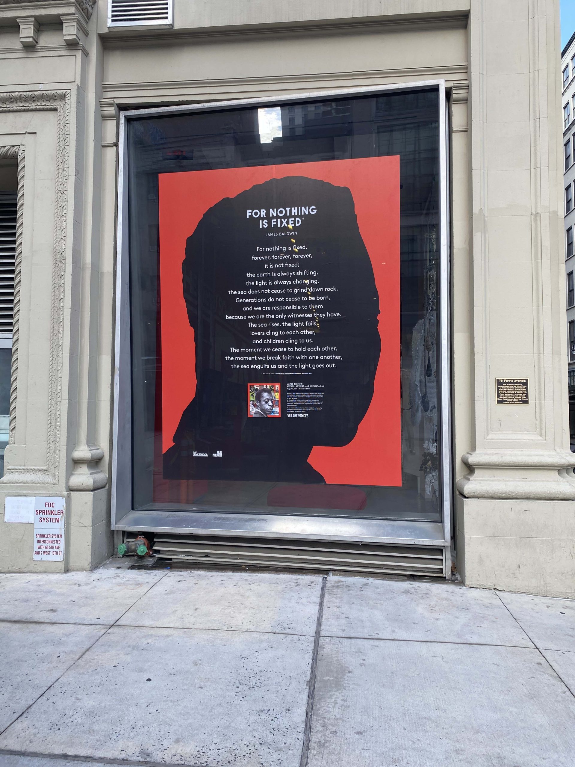 The large window installation at The New School's 70 Fifth Avenue building features a passage from Baldwin’s book Nothing Personal (photo courtesy of Village Preservation)